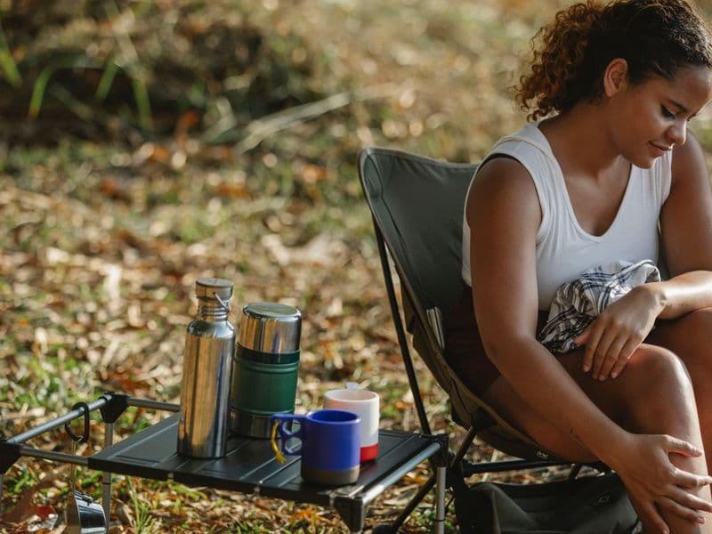 A peaceful outdoor campsite at golden hour, the kind of multi-day trip where cooler choice matters most
