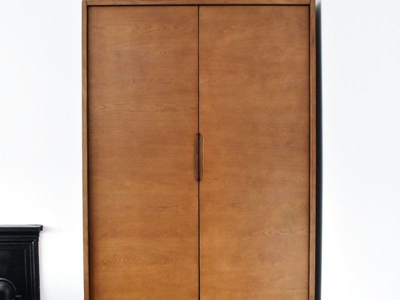 An organized closet of clothes on matching slim hangers
