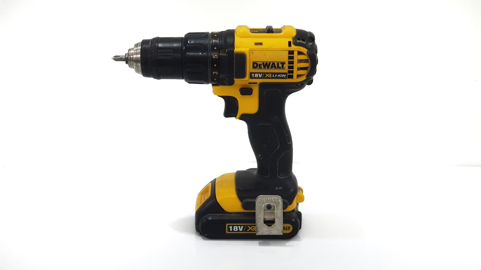 Black and yellow cordless drill/driver on a workbench, representing budget cordless drills under $100