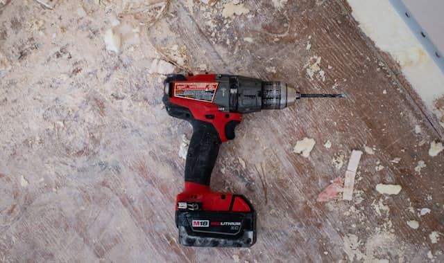 A cordless drill driver and impact driver positioned side by side