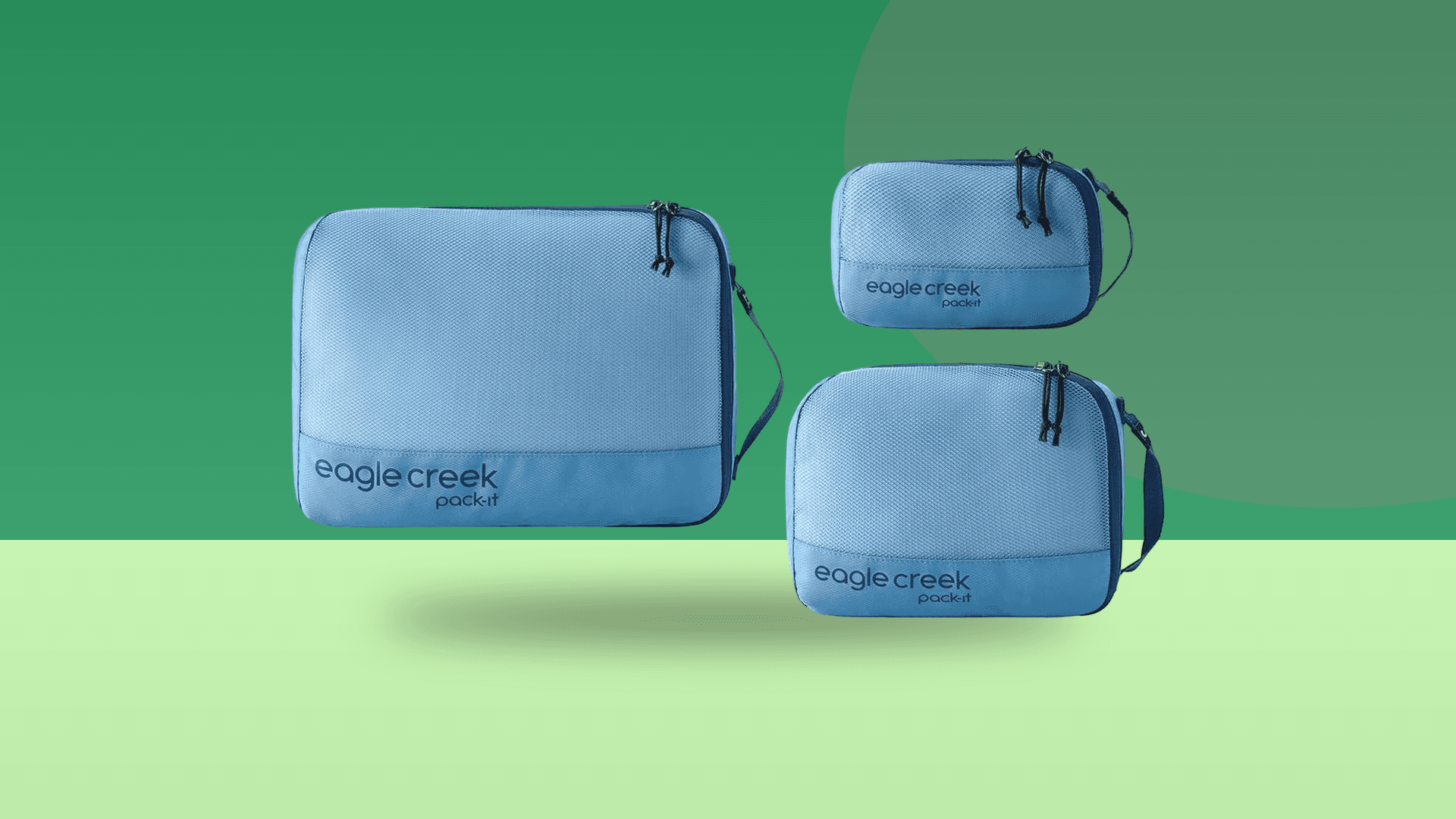 Eagle Creek Pack-It Reveal three-cube set cut out on a green background