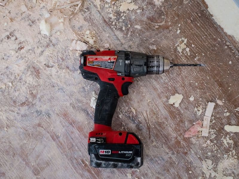Cordless drills and driver kits arranged on a workbench