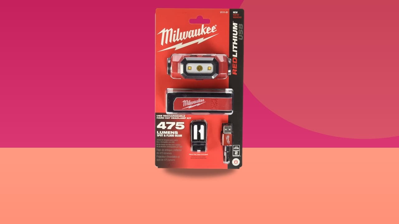 Milwaukee 2111-21 475-lumen USB rechargeable hard hat headlamp on a colorful studio background