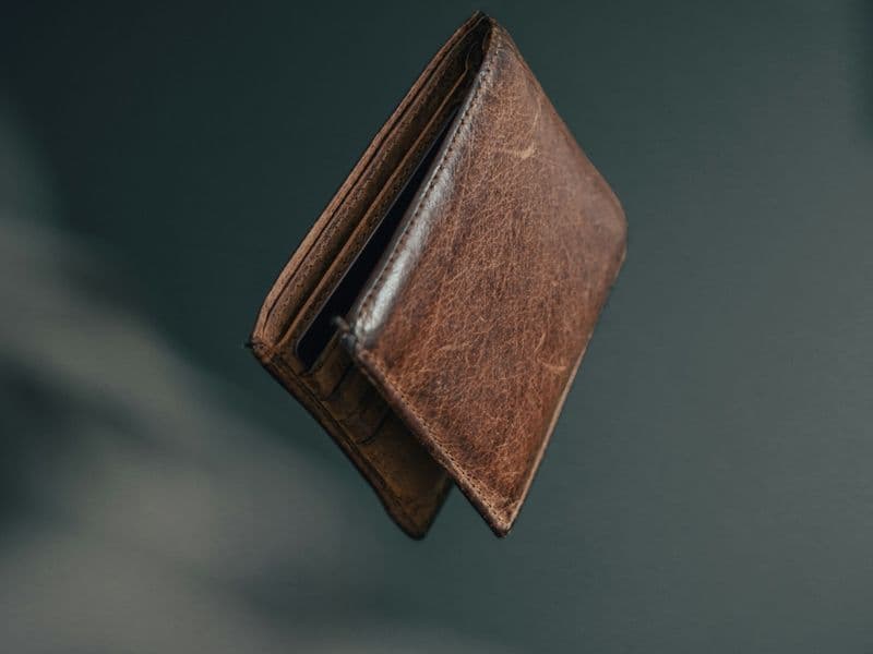 Minimalist men's slim wallet with cards laid out for everyday carry
