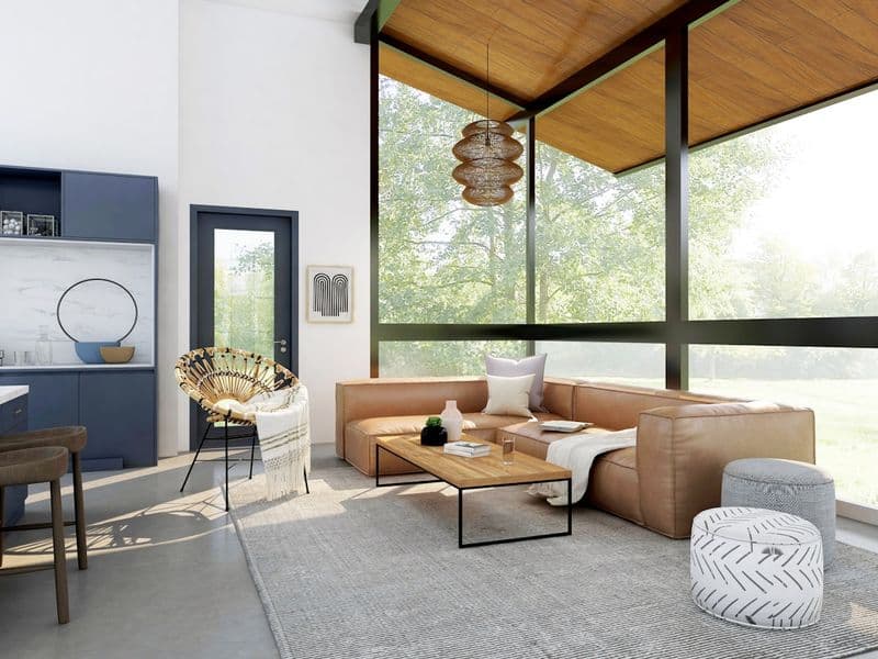 Outdoor patio furniture with cushions under a light rain on a covered deck