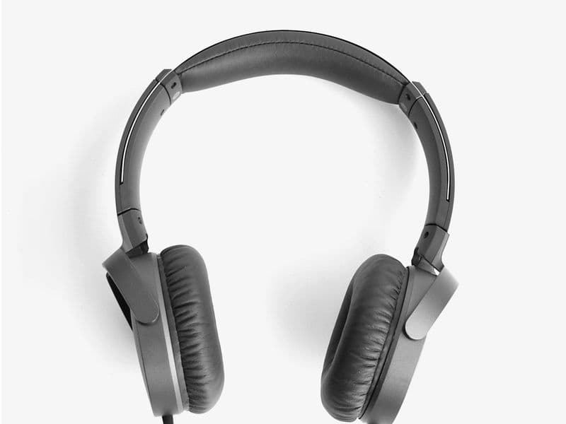 Sony WH-1000XM6 over-ear noise-cancelling headphones folded beside their magnetic-clasp case
